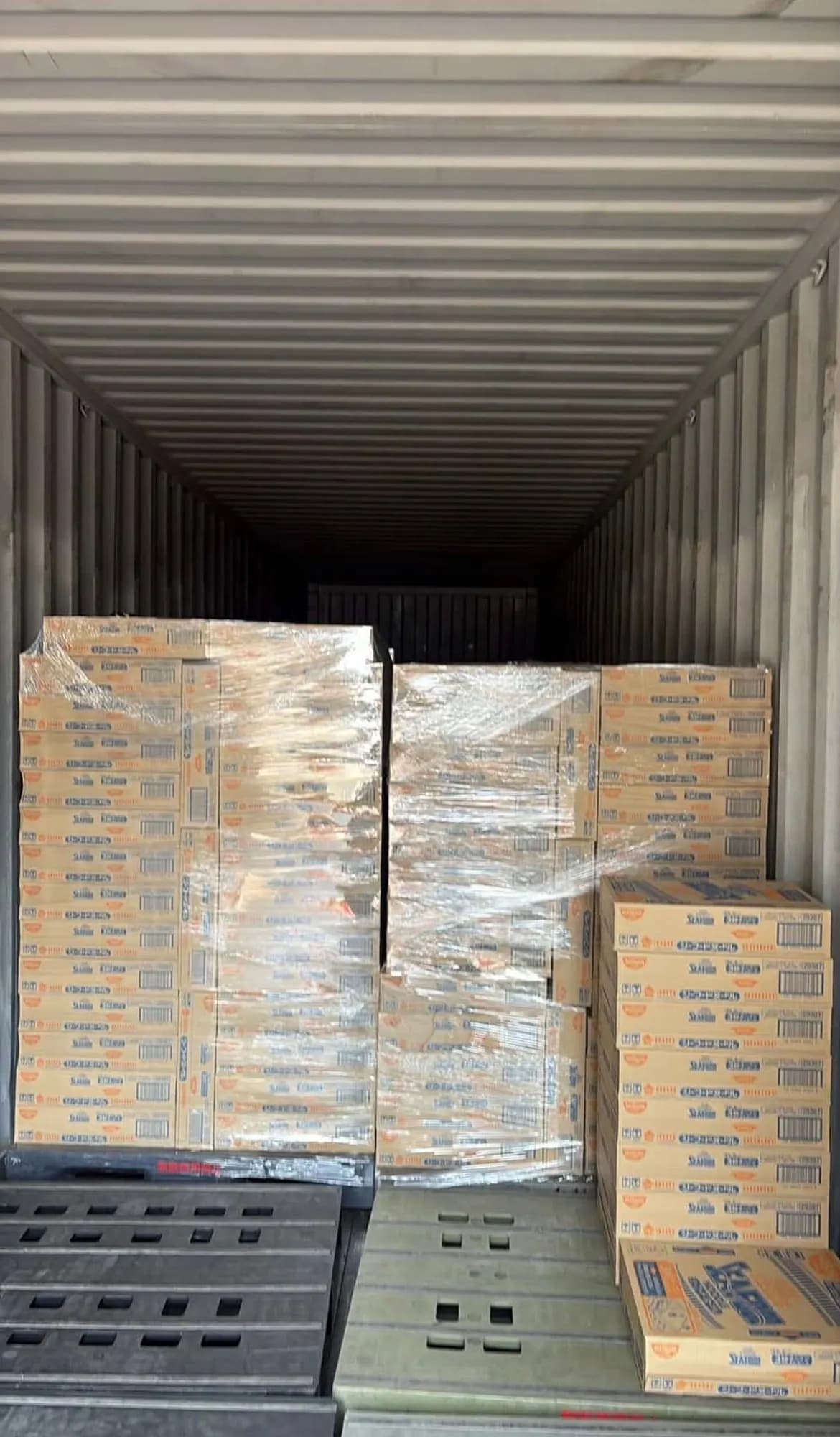 Palletised cartons loaded inside a shipping container